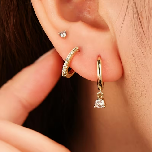 Éclat Dorée 3-Piece Earring Set – close-up of gold hoop with zirconia drop and pavé huggie