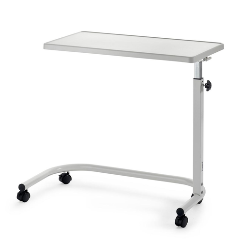 Adjustable overbed table with wooden top and castors next to home bed with food on top