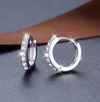 Lumière Pavé Huggie Hoop Earrings – silver micro-pavé zirconia huggies on white background
