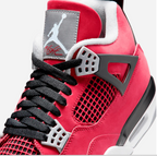 Air Jordan 4 Retro Toro Bravo – close-up detail of grey Jumpman tongue patch and FLIGHT script with black mesh netting