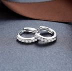 Lumière Pavé Huggie Hoop Earrings – close-up of zirconia pavé setting detail