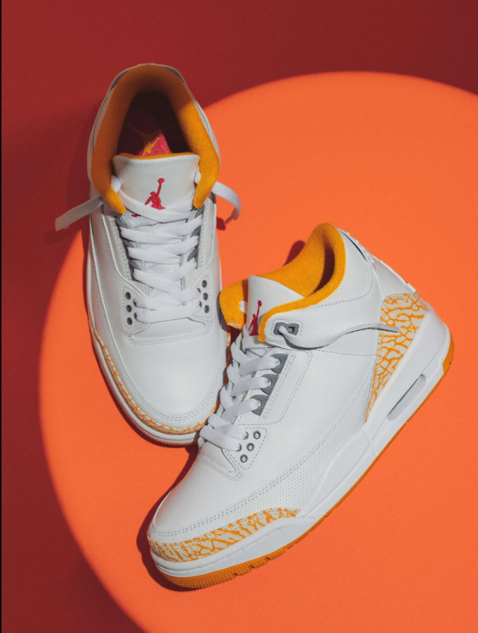 Air Jordan 3 Retro White Orange Peel Womens – lifestyle shot on orange background