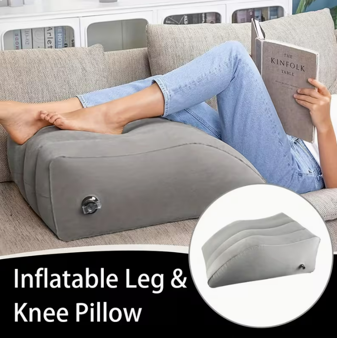 Inflatable leg and knee pillow in use — reading and relaxing on couch