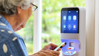 Elderly woman using smart medication dispenser